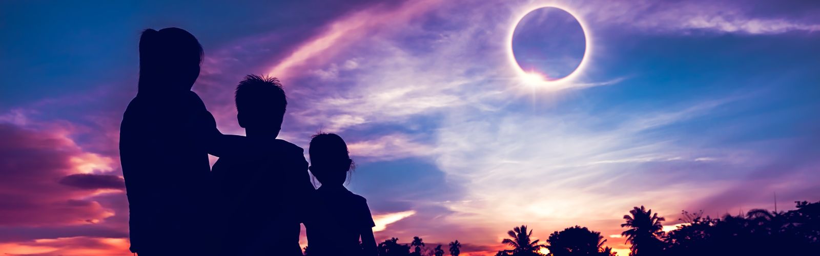 family watching a solar eclipse